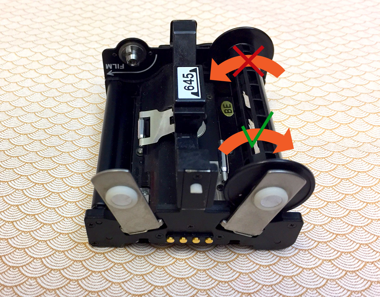 The bottom take-up spool from a medium format film camera